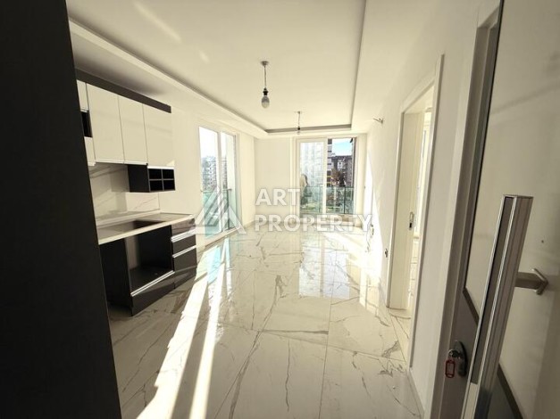 Квартира 1+1 в новом комплексе 2024 года в Махмутларе, 55 м², 700 метров до моря - Ракурс 3