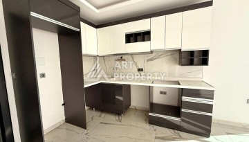 Квартира 1+1 в новом комплексе 2024 года в Махмутларе, 55 м², 700 метров до моря - Ракурс 5