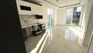 Квартира 1+1 в новом комплексе 2024 года в Махмутларе, 55 м², 700 метров до моря - Ракурс 7