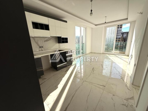 Квартира 1+1 в новом комплексе 2024 года в Махмутларе, 55 м², 700 метров до моря - Ракурс 6