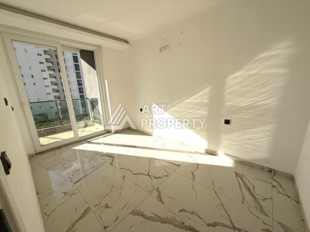 Квартира 1+1 в новом комплексе 2024 года в Махмутларе, 55 м², 700 метров до моря - Ракурс 8