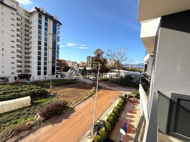 Квартира 1+1 в новом комплексе 2024 года в Махмутларе, 55 м², 700 метров до моря - Ракурс 21