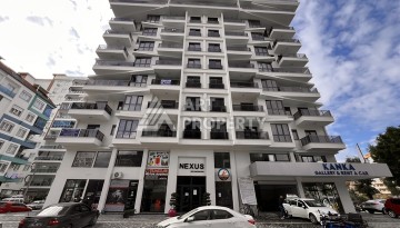 Квартира 1+1 с видом на море в Махмутларе, 57 м², дом 2025 года - Ракурс 1