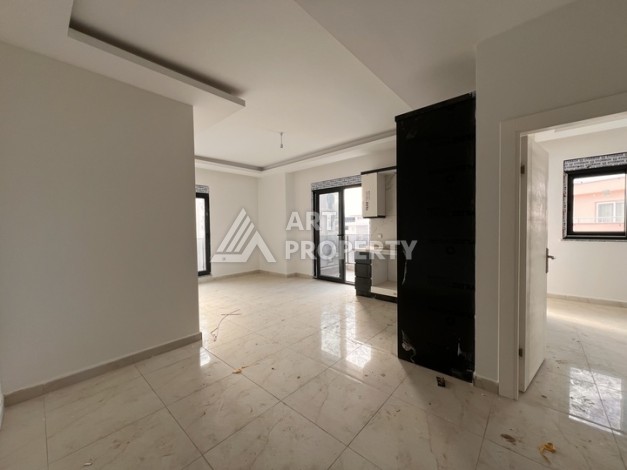 Квартира 1+1 с видом на море в Махмутларе, 57 м², дом 2025 года - Ракурс 1