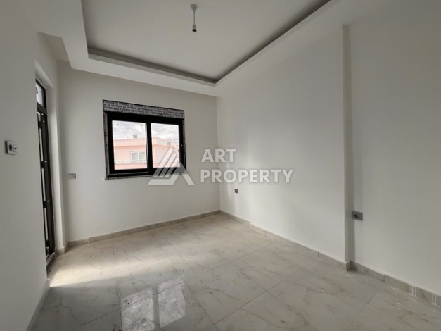 Квартира 1+1 с видом на море в Махмутларе, 57 м², дом 2025 года - Ракурс 2