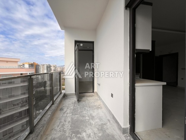 Квартира 1+1 с видом на море в Махмутларе, 57 м², дом 2025 года - Ракурс 14