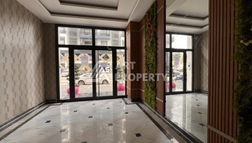 Квартира 1+1 с видом на море в Махмутларе, 57 м², дом 2025 года - Ракурс 26