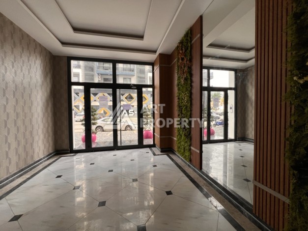 Квартира 1+1 с видом на море в Махмутларе, 57 м², дом 2025 года - Ракурс 25