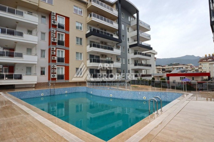 Современная квартира 1+1 в районе Тосмур — отличное решение для комфортной жизни у моря и выгодной инвестиции. - Ракурс 3