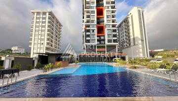 Квартира 1+1 в современном комплексе, 650 м до моря, центр Махмутлара - Ракурс 1