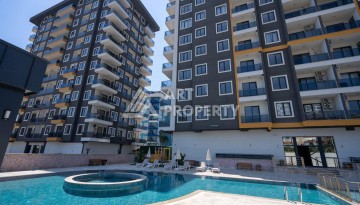 Апартаменты 1+1 в районе Махмутлар в современном жилом комплексе с полной инфраструктурой. - Ракурс 1