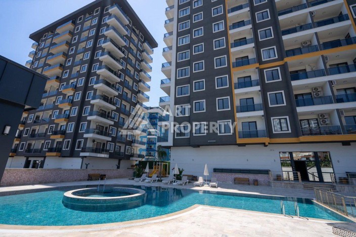 Апартаменты 1+1 в районе Махмутлар в современном жилом комплексе с полной инфраструктурой. - Ракурс 0