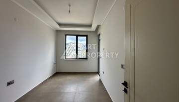 Апартаменты 1+1 в районе Махмутлар в современном жилом комплексе с полной инфраструктурой. - Ракурс 2