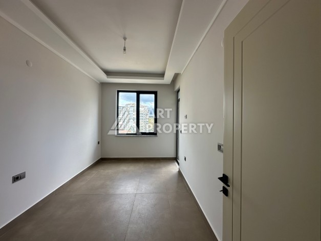 Апартаменты 1+1 в районе Махмутлар в современном жилом комплексе с полной инфраструктурой. - Ракурс 1