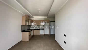 Апартаменты 1+1 в районе Махмутлар в современном жилом комплексе с полной инфраструктурой. - Ракурс 3