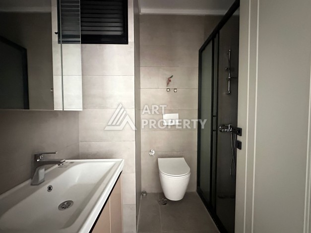 Апартаменты 1+1 в районе Махмутлар в современном жилом комплексе с полной инфраструктурой. - Ракурс 3