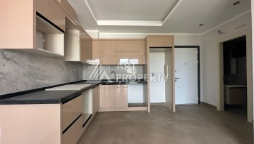 Апартаменты 1+1 в районе Махмутлар в современном жилом комплексе с полной инфраструктурой. - Ракурс 6