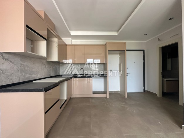 Апартаменты 1+1 в районе Махмутлар в современном жилом комплексе с полной инфраструктурой. - Ракурс 5