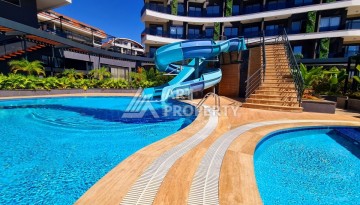 Квартира 1+1 в элитной резиденции района Оба, Алания — 55 м² с видом на бассейн - Ракурс 2