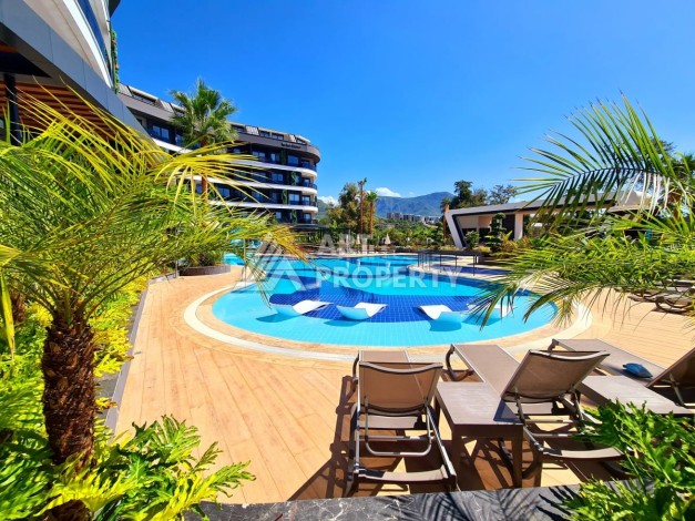 Квартира 1+1 в элитной резиденции района Оба, Алания — 55 м² с видом на бассейн - Ракурс 2