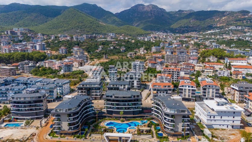 Квартира 1+1 в элитной резиденции района Оба, Алания — 55 м² с видом на бассейн - Ракурс 12