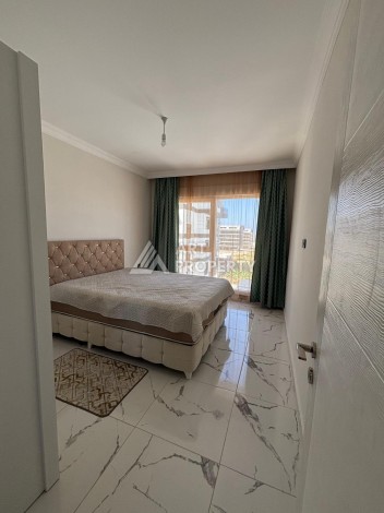 Апартаменты 1+1 с видом на море в районе Каргыджак, всего в 250 метрах от пляжа. - Ракурс 2