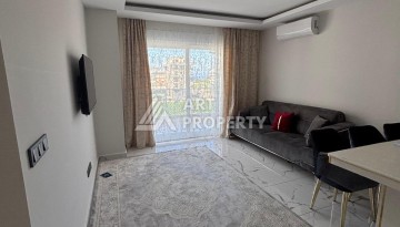 Апартаменты 1+1 с видом на море в районе Каргыджак, всего в 250 метрах от пляжа. - Ракурс 9