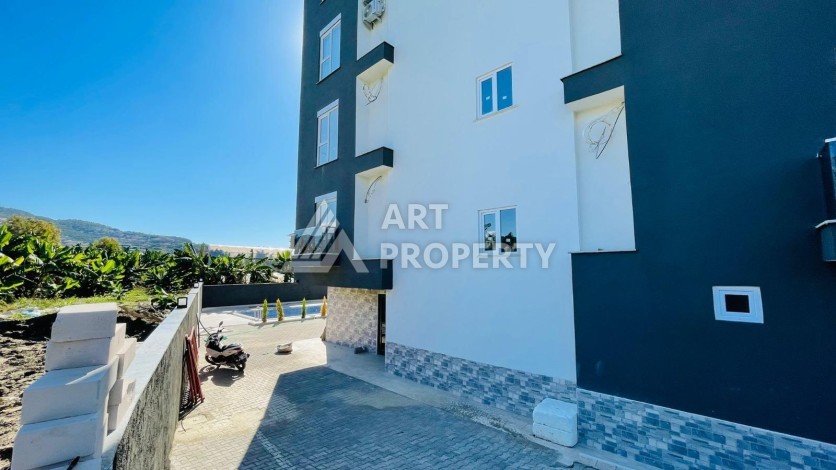 Апартаменты 1+1 с видом на море в районе Каргыджак, всего в 250 метрах от пляжа. - Ракурс 11