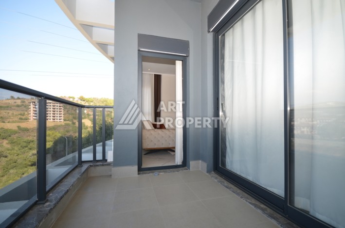 Апартаменты 2+1 с видом на море и горы в комплексе с полной рабочей инфраструктурой, район Демирташ. - Ракурс 8