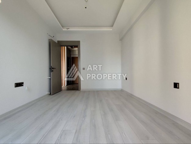 Просторная квартира 1+1 в Арпачбахшиш, Мерсин, 60 кв.м. - Ракурс 2