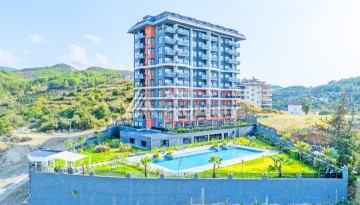 Современная квартира 2+1 с видоми на горы, море и город в современном комплексе Демирташ. - Ракурс 1