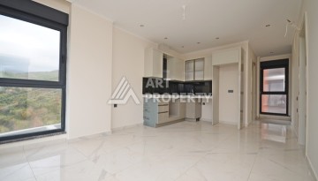 Современная квартира 2+1 с видоми на горы, море и город в современном комплексе Демирташ. - Ракурс 2