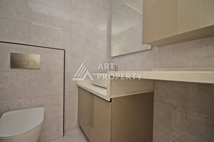 Современная квартира 2+1 с видоми на горы, море и город в современном комплексе Демирташ. - Ракурс 4