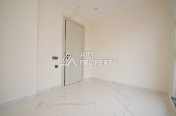 Современная квартира 2+1 с видоми на горы, море и город в современном комплексе Демирташ. - Ракурс 6