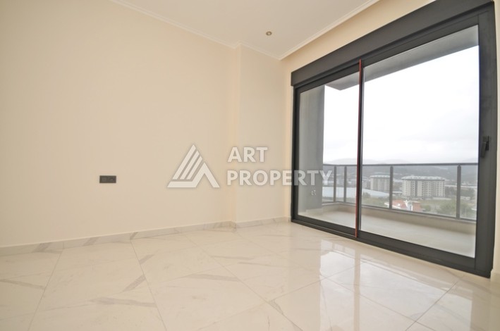 Современная квартира 2+1 с видоми на горы, море и город в современном комплексе Демирташ. - Ракурс 7