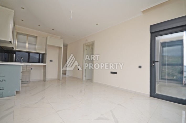 Современная квартира 2+1 с видоми на горы, море и город в современном комплексе Демирташ. - Ракурс 9