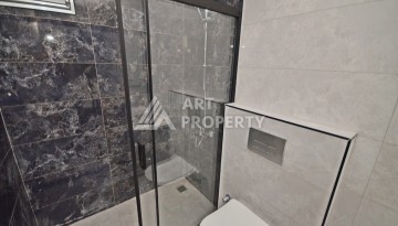 Современная квартира 2+1 с видоми на горы, море и город в современном комплексе Демирташ. - Ракурс 11