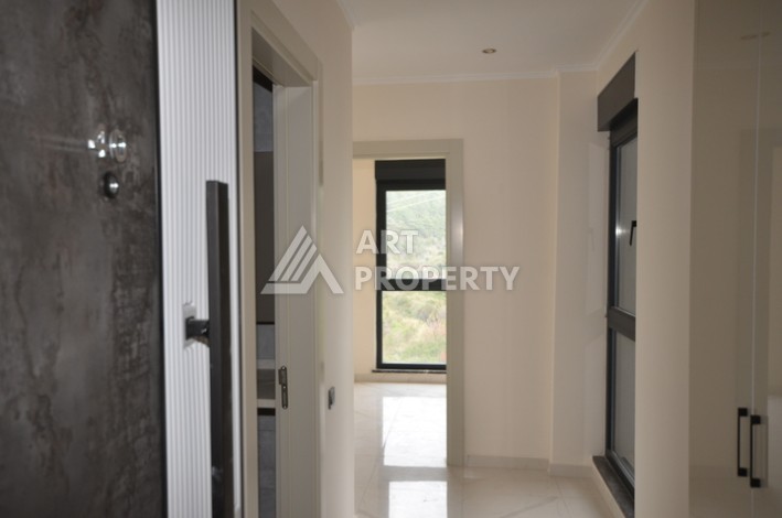 Современная квартира 2+1 с видоми на горы, море и город в современном комплексе Демирташ. - Ракурс 11