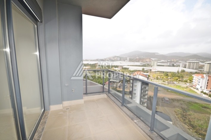 Современная квартира 2+1 с видоми на горы, море и город в современном комплексе Демирташ. - Ракурс 12