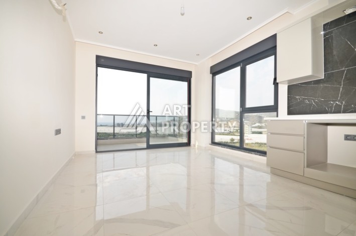 Уютная квартира 1+1 с потрясающим видом на море и город в современном комплексе в районе Демирташ. - Ракурс 0