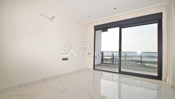 Уютная квартира 1+1 с потрясающим видом на море и город в современном комплексе в районе Демирташ. - Ракурс 2