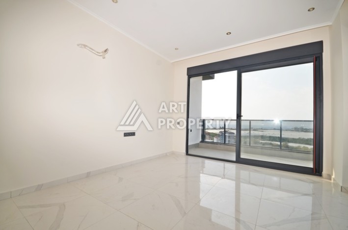 Уютная квартира 1+1 с потрясающим видом на море и город в современном комплексе в районе Демирташ. - Ракурс 1