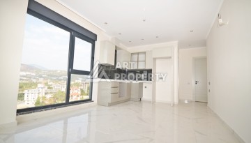 Уютная квартира 1+1 с потрясающим видом на море и город в современном комплексе в районе Демирташ. - Ракурс 4