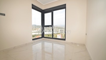 Уютная квартира 1+1 с потрясающим видом на море и город в современном комплексе в районе Демирташ. - Ракурс 6