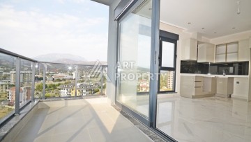 Уютная квартира 1+1 с потрясающим видом на море и город в современном комплексе в районе Демирташ. - Ракурс 9