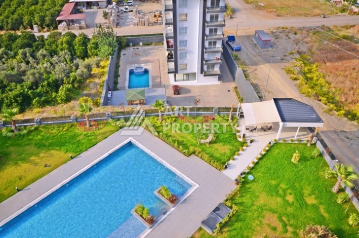 Уютная квартира 1+1 с потрясающим видом на море и город в современном комплексе в районе Демирташ. - Ракурс 26