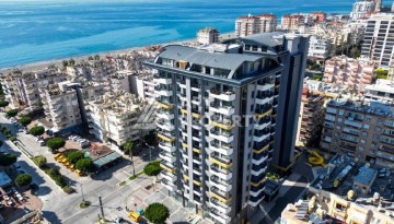 Стильная квартира 2+1 в новом комплексе всего в 150 метрах от моря в районе Махмутлар. - Ракурс 1