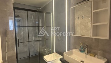 Стильная квартира 2+1 в новом комплексе всего в 150 метрах от моря в районе Махмутлар. - Ракурс 17