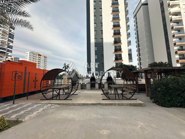 Квартира 1+1 с отдельной кухней в районе Томюк, Мерсин — 450 м до моря - Ракурс 1