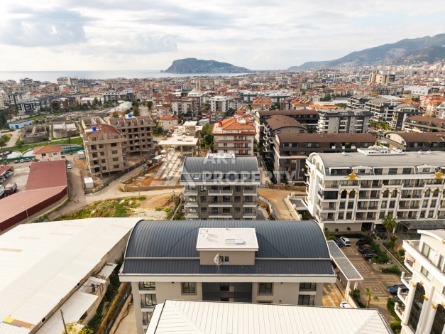 Квартира 1+1 в новом доме в районе Оба, 53 кв.м. - Ракурс 1